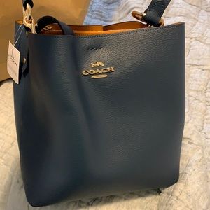 Brand new never used coach bucket bag